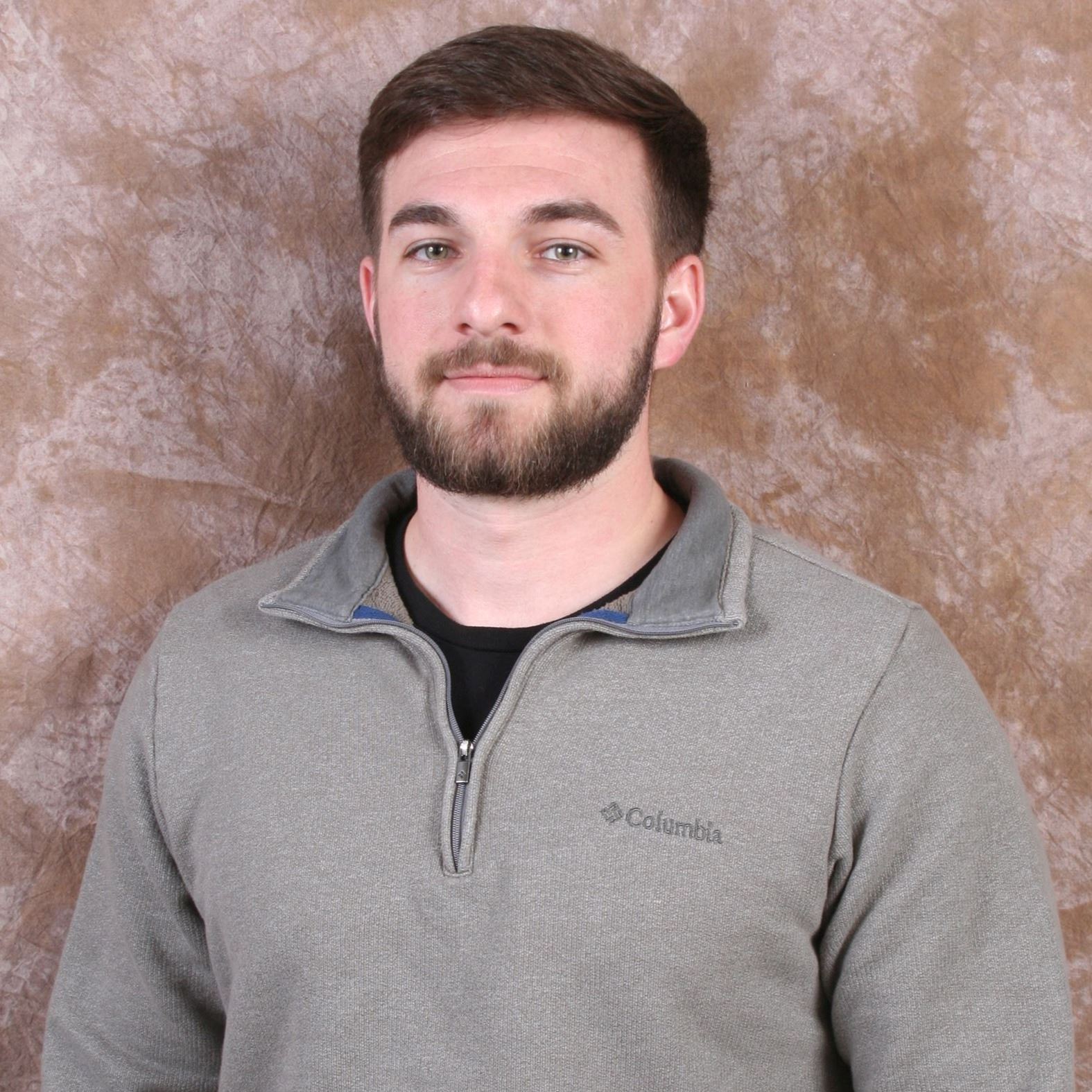 man smiling, sitting