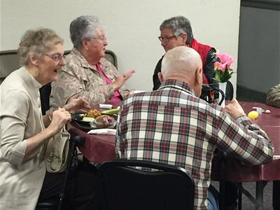 Photo of Seniors enjoying lunch at the Senior Center